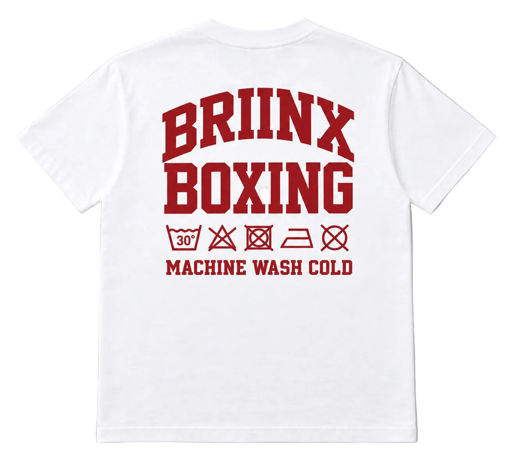 White short-sleeve T-shirt shown from the back, featuring a large red 'BRIINX BOXING' graphic with laundry care symbols and 'MACHINE WASH COLD' printed below, on a light gray background.