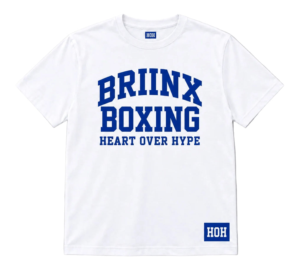A white short-sleeve crewneck t-shirt with blue collegiate-style text reading 'BRIINX BOXING' and 'HEART OVER HYPE' on the front, plus a blue 'HOH' logo patch near the lower right hem, shown on a light gray background.