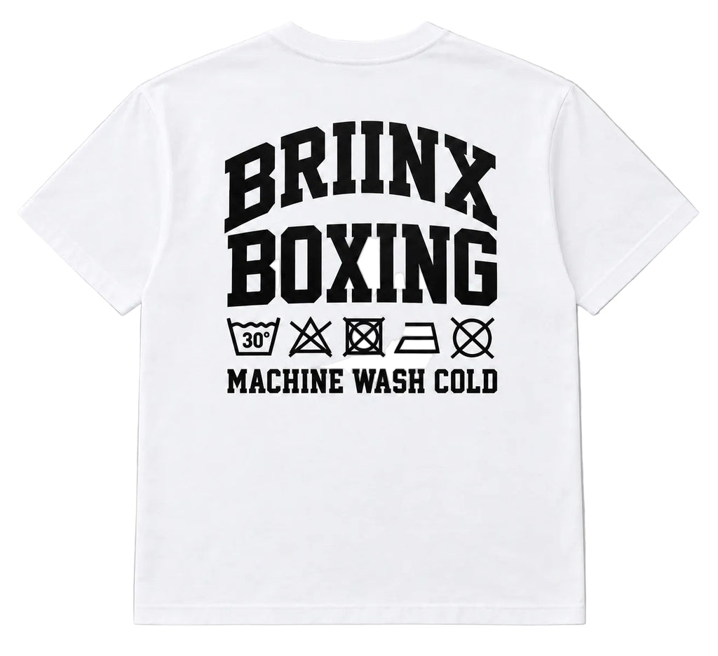 White short-sleeve t-shirt with a large black graphic print on the back reading 'BRIINX BOXING' and 'MACHINE WASH COLD' with laundry care symbols underneath, shown on a neutral gray background.